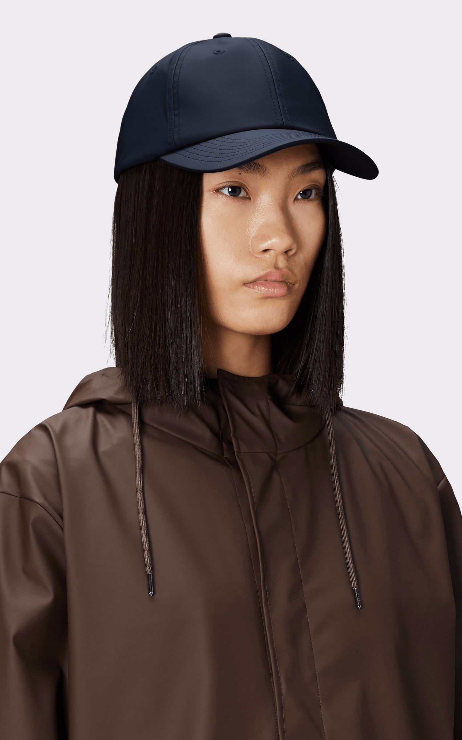 A "13600 CASQUETTE" Bleu Marine Rains Casquette Mixte closed photo