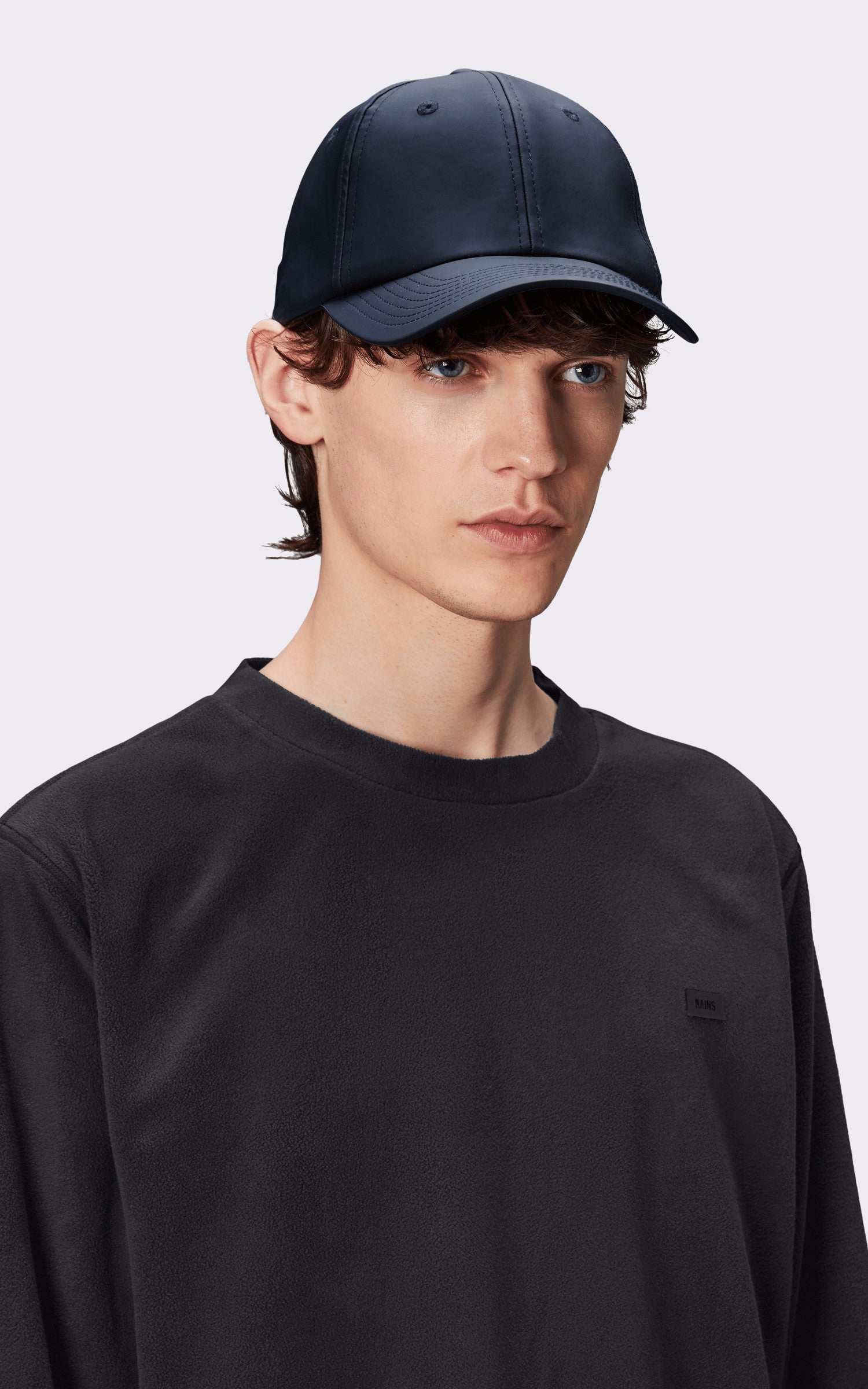 A "13600 CASQUETTE" Bleu Marine Rains Casquette Mixte opened photo
