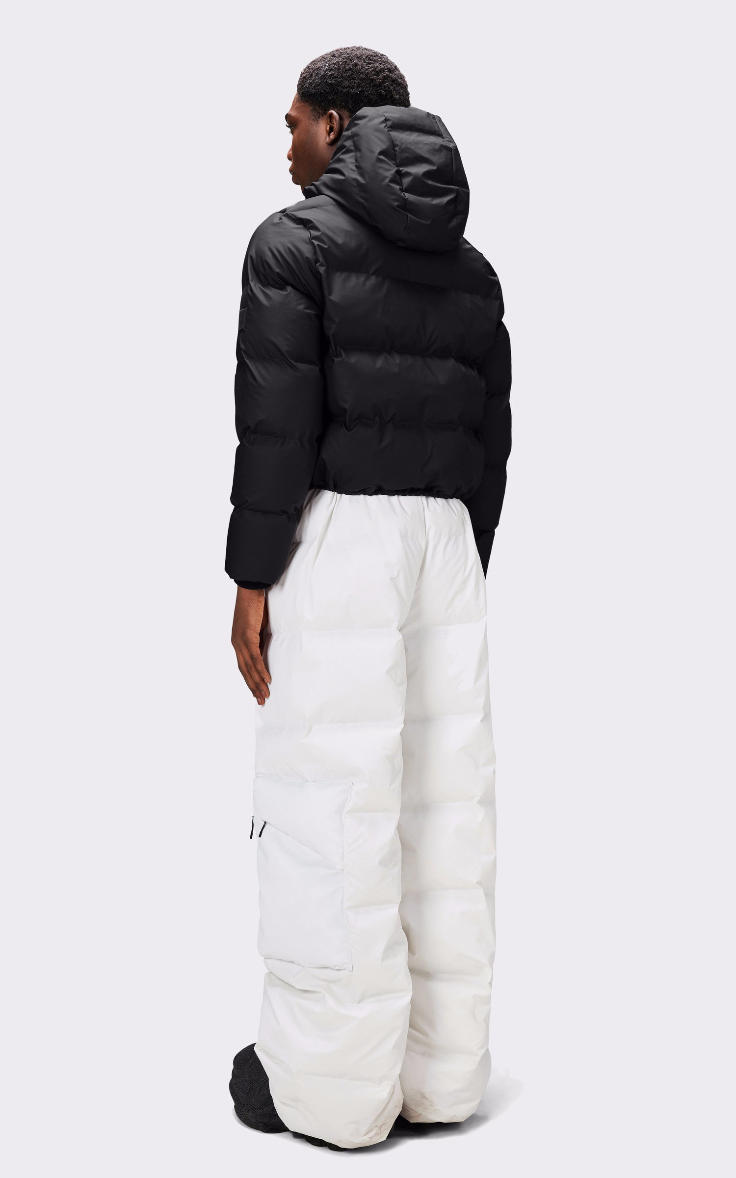 A "15150 ALTA PUFFER JACKET" Noir Rains 3/4 Doudoune Mixte interior photo