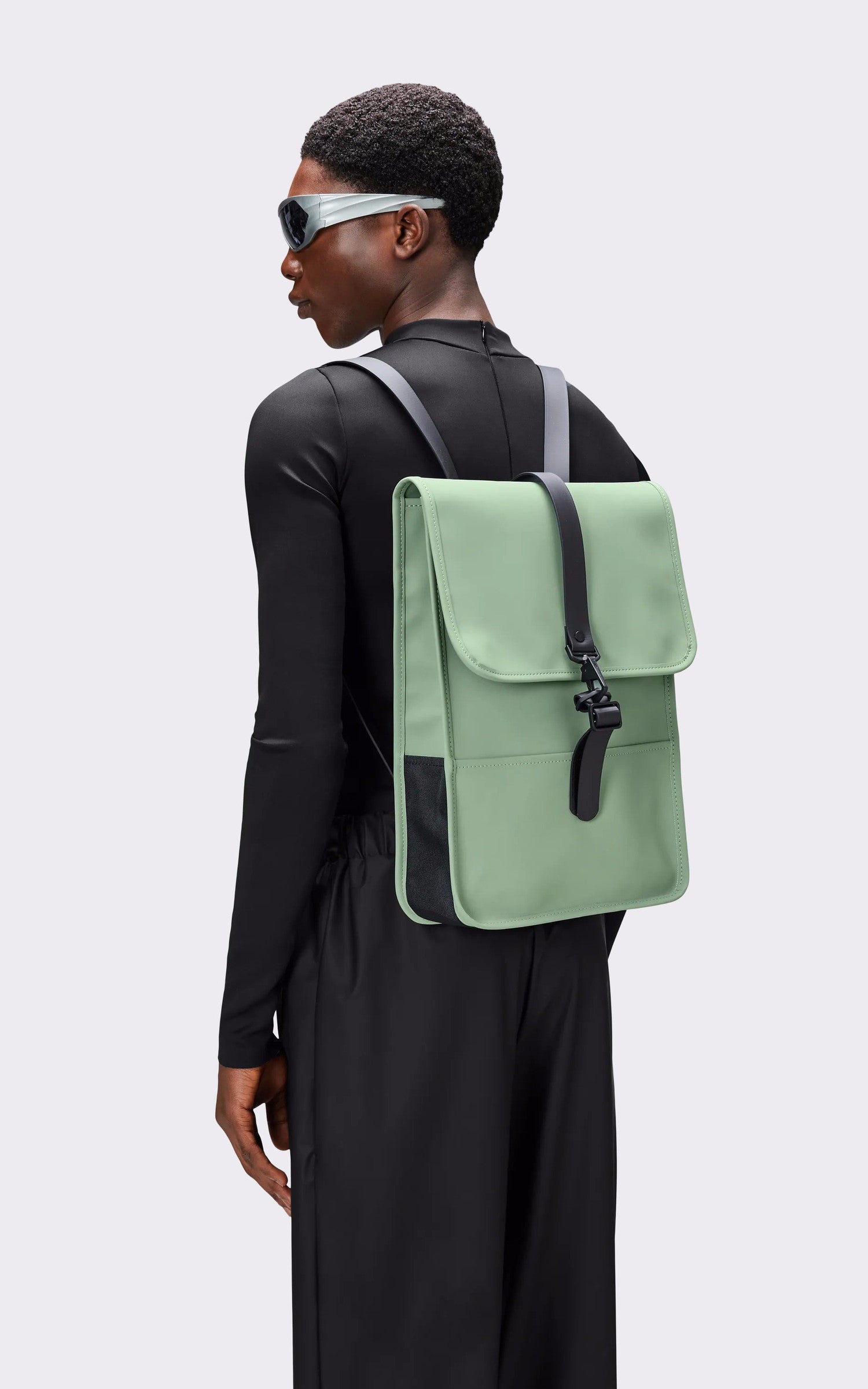 A "13020 BACK PACK MINI" Bleu Rains Sac A Dos Mixte opened photo