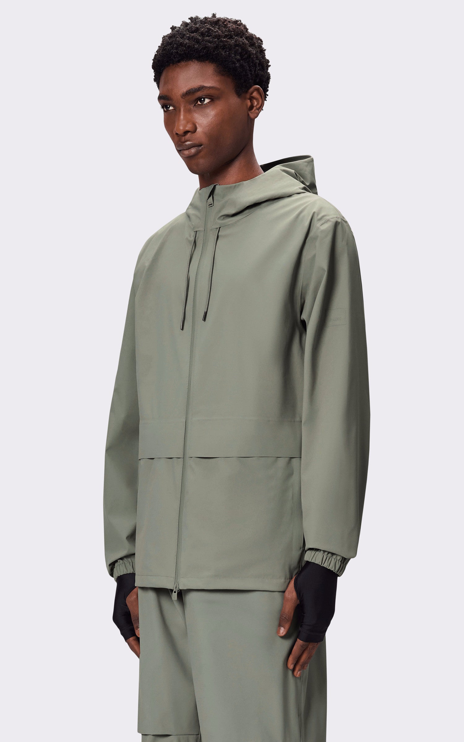 A "12420 SUVA HARDSHELL POCKET" Kaki Rains Veste Mixte closed photo
